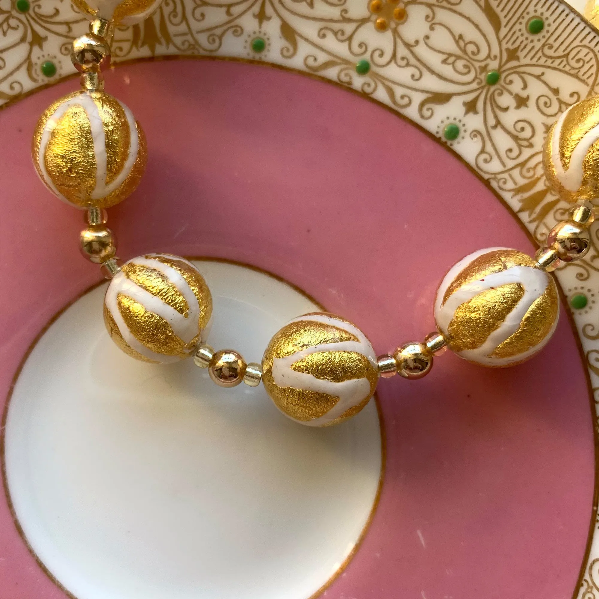 Necklace with white pastel drizzle and gold Murano glass small sphere beads on gold